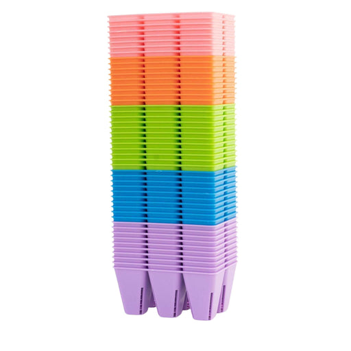 Stacked colorful plastic nursery pots: pink, orange, green, blue, purple. Multi-cell seedling starter trays with drainage.