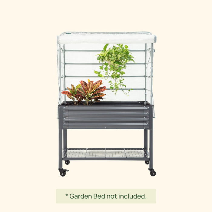Wheeled raised garden bed enclosure with white mesh cover, dark gray frame, and storage shelf. Protects plants.