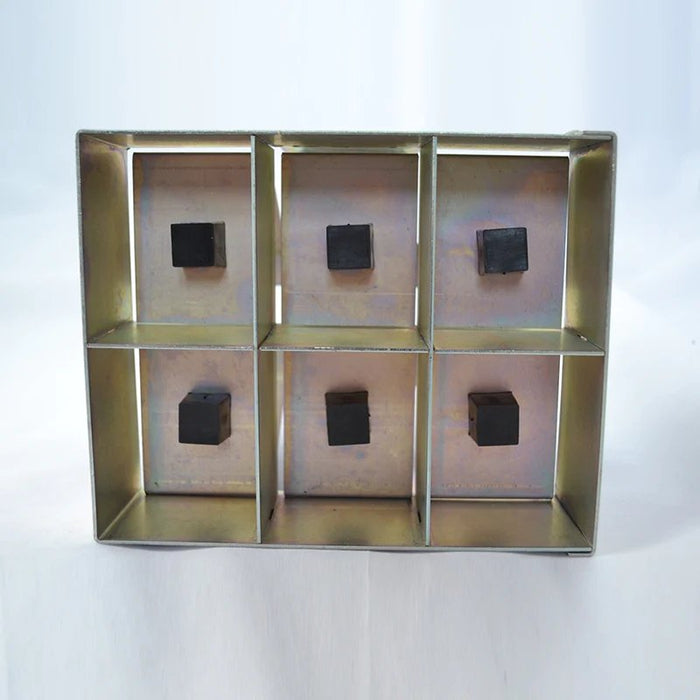 Galvanized metal 6-compartment sample holder with six black cubes. Lab equipment, industrial storage.
